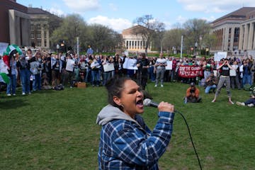 Activist Nicole Mason, known as the Angry Grandma, leads a Pro-Palestine chant during a rally against the war in Gaza after the University of Minnesot