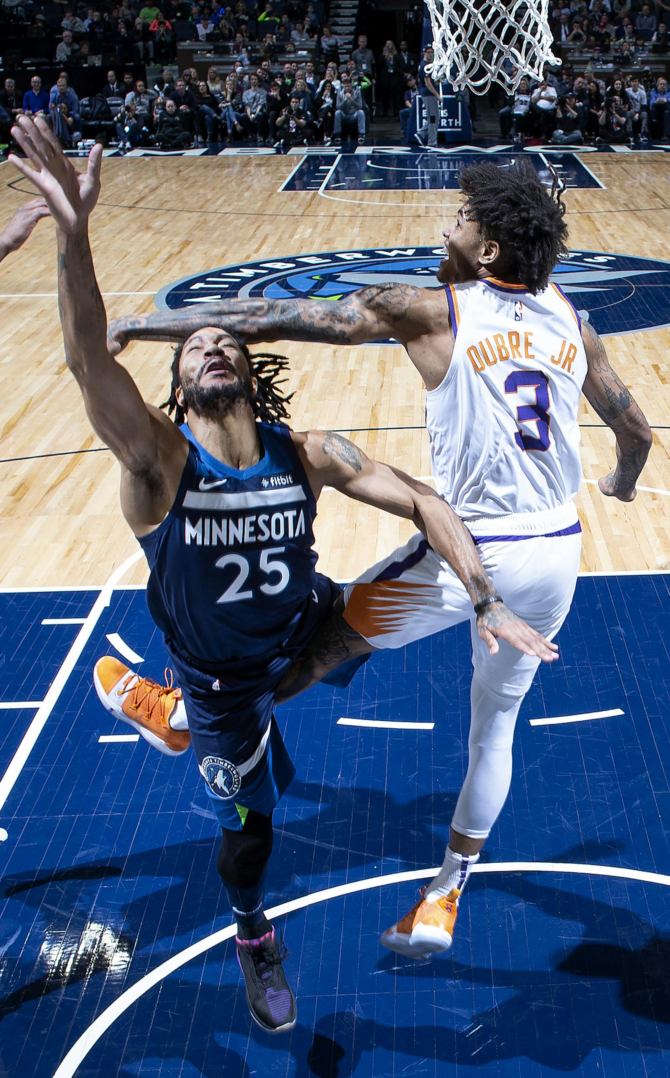 Derrick Rose, with arms and legs flying, took the ball to the rim while against Phoenix's Kelly Oubre Jr. in the second half Sunday. Rose finished with 31 points, including the winning basket.