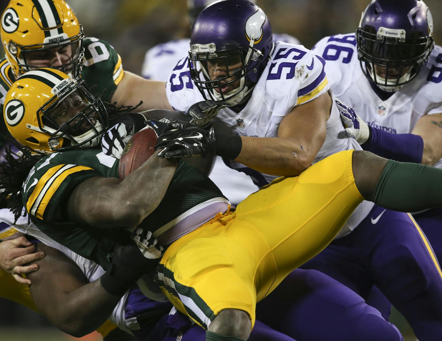 Packers running back Eddie Lacy lost 2 yards on a run in the second quarter, stacked up by outside linebacker Anthony Barr (55) and several other Vikings defenders at Lambeau Field on Sunday night.