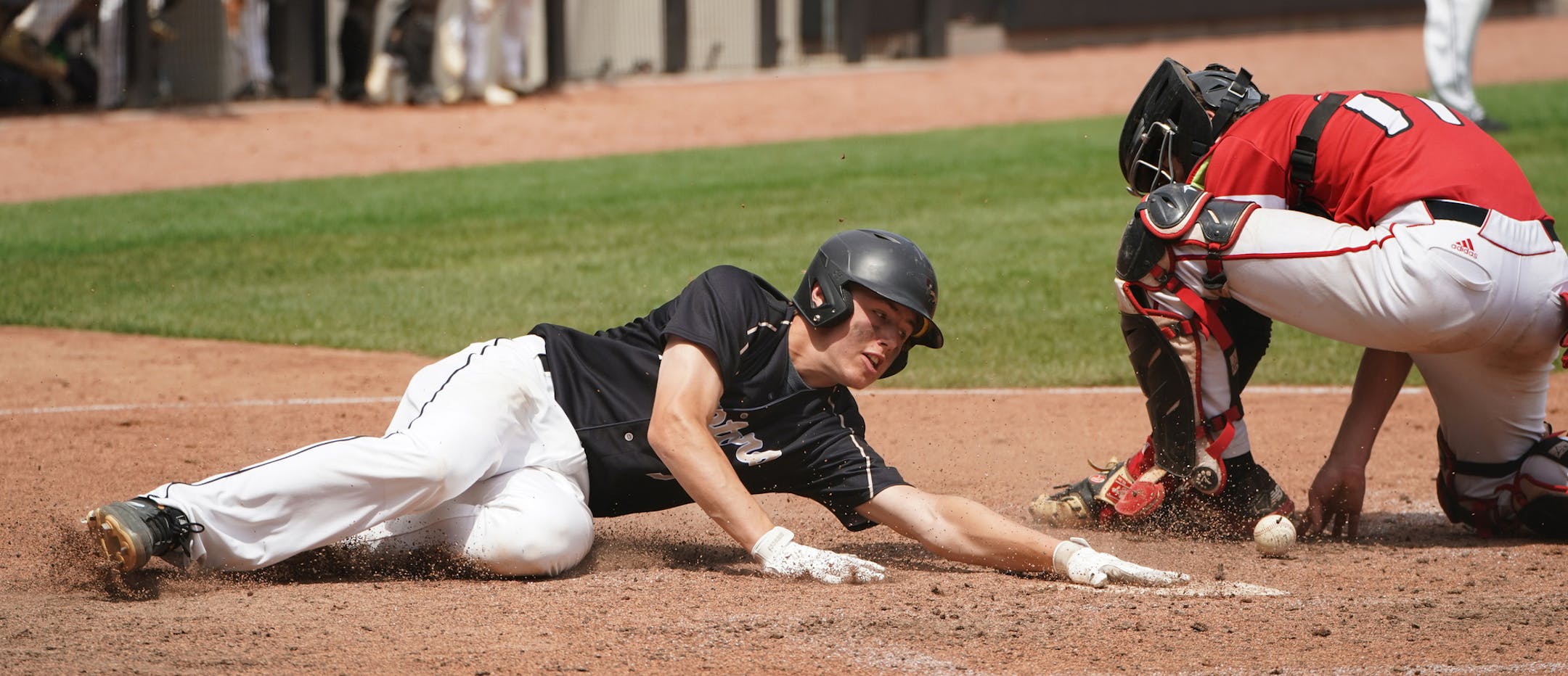 East Ridge infielder Ben North (3) slid safely into home as Stillwater catcher Logan Jordan (17) couldn't hold onto the ball in the eighth inning. ] Shari L. Gross • shari.gross@startribune.com East Ridge upset top seeded Stillwater 6-5 in eight innings in a state 4a semifinal baseball game at CHS Field in St. Paul, Minnesota on Saturday, June 15, 2019.