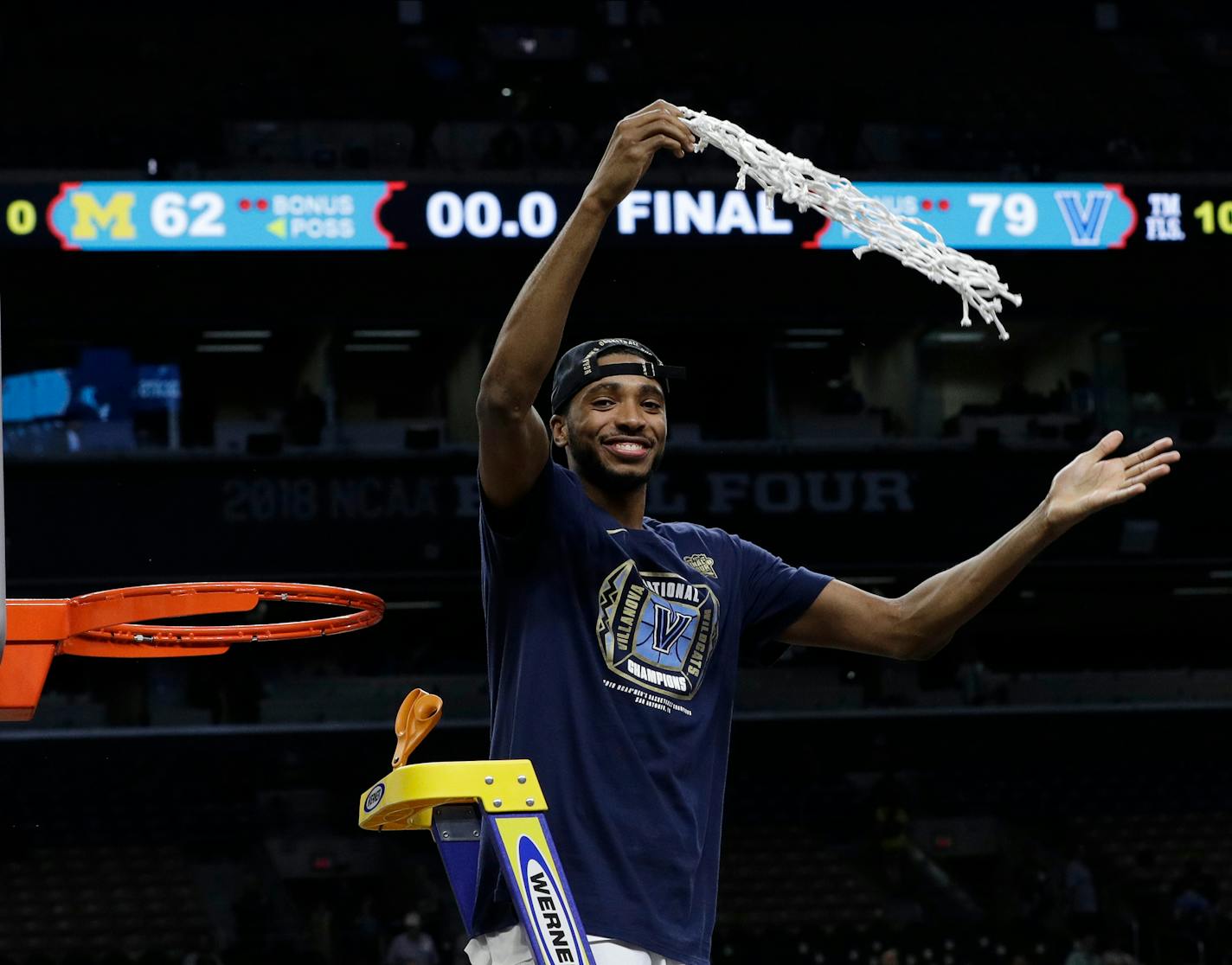 Villanova's Mikal Bridges cuts the net as he celebrates after the championship game of the Final Four NCAA college basketball tournament against Michigan, Monday, April 2, 2018, in San Antonio. Villanova won 79-62. (AP Photo/David J. Phillip)