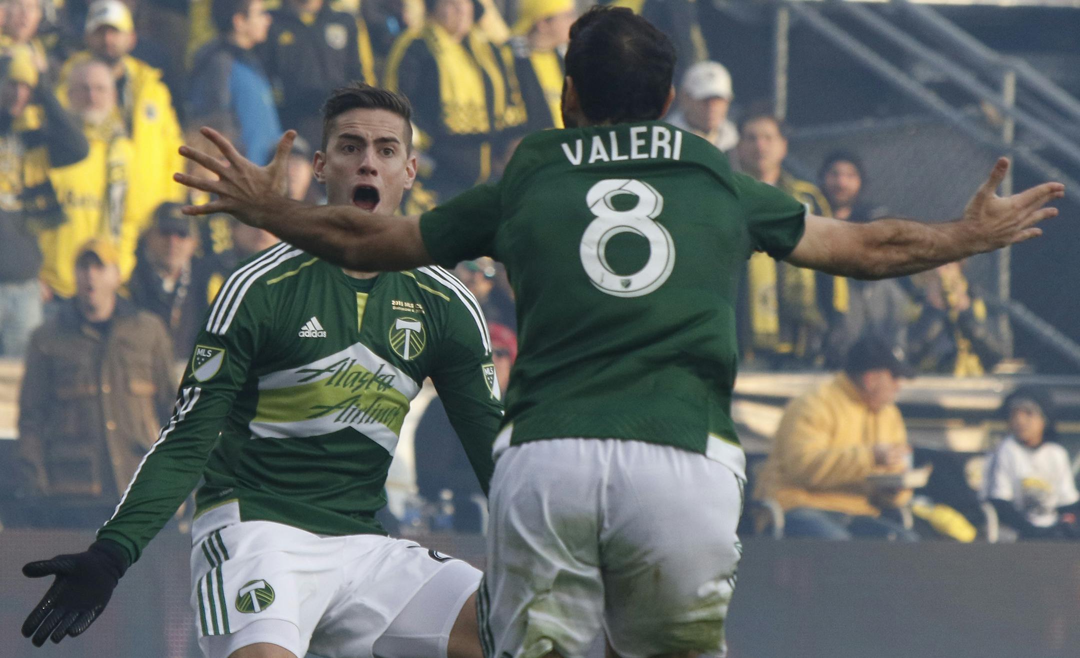 Portland Timbers midfielder Diego Valeri, right, of Argentina, celebrates his goal against the Columbus Crew with teammate forward Lucas Melano, of Argentina, during the first half of the MLS Cup championship soccer game, Sunday, Dec. 6, 2015, in Columbus, Ohio. (AP Photo/Paul Vernon)