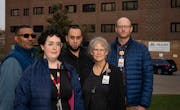 Chaplains recently laid off stand for a portrait outside a University of Minnesota health clinic in Minneapolis, Minn., on Wednesday, Nov. 8, 2023. St