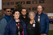 Chaplains recently laid off stand for a portrait outside a University of Minnesota health clinic in Minneapolis, Minn., on Wednesday, Nov. 8, 2023. St