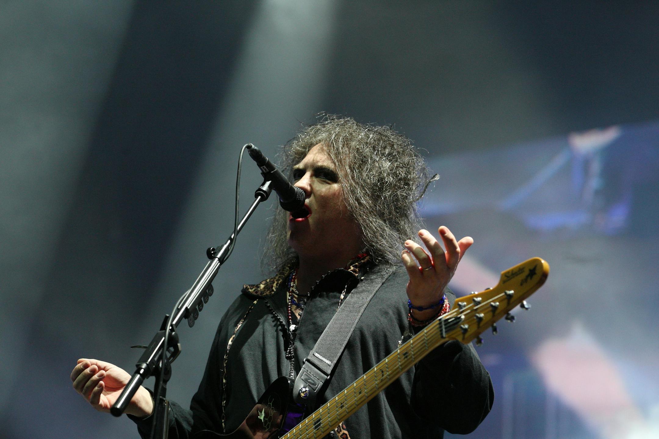 Robert Smith of The Cure performs on day 3 of Lollapalooza 2013 at Grant Park on Sunday, Aug.4, 2013 in Chicago. (Photo by Steve Mitchell/Invision/AP) ORG XMIT: MIN2013081319031663