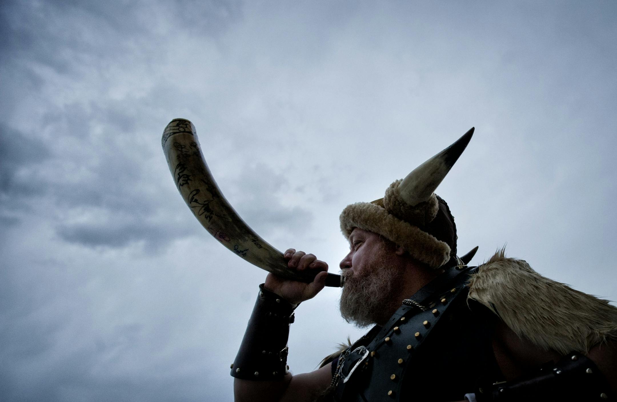 Heavy rain showers moved through St. Paul Thursday morning as Greg Hanson who goes by the name Sir Odin blew his Viking horn on the steps of the Capitol. Thursday, May 3, 2012.