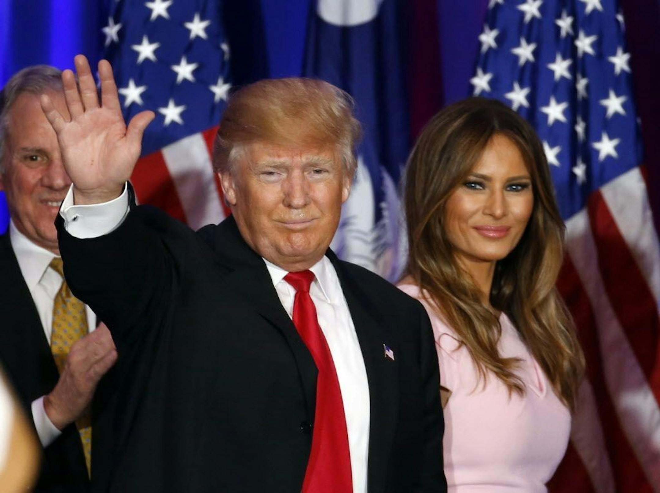 Republican presidential candidate Donald Trump waves with his wife Melania, during a South Carolina Republican primary night event, Saturday, Feb. 20, 2016 in Spartanburg, S.C.