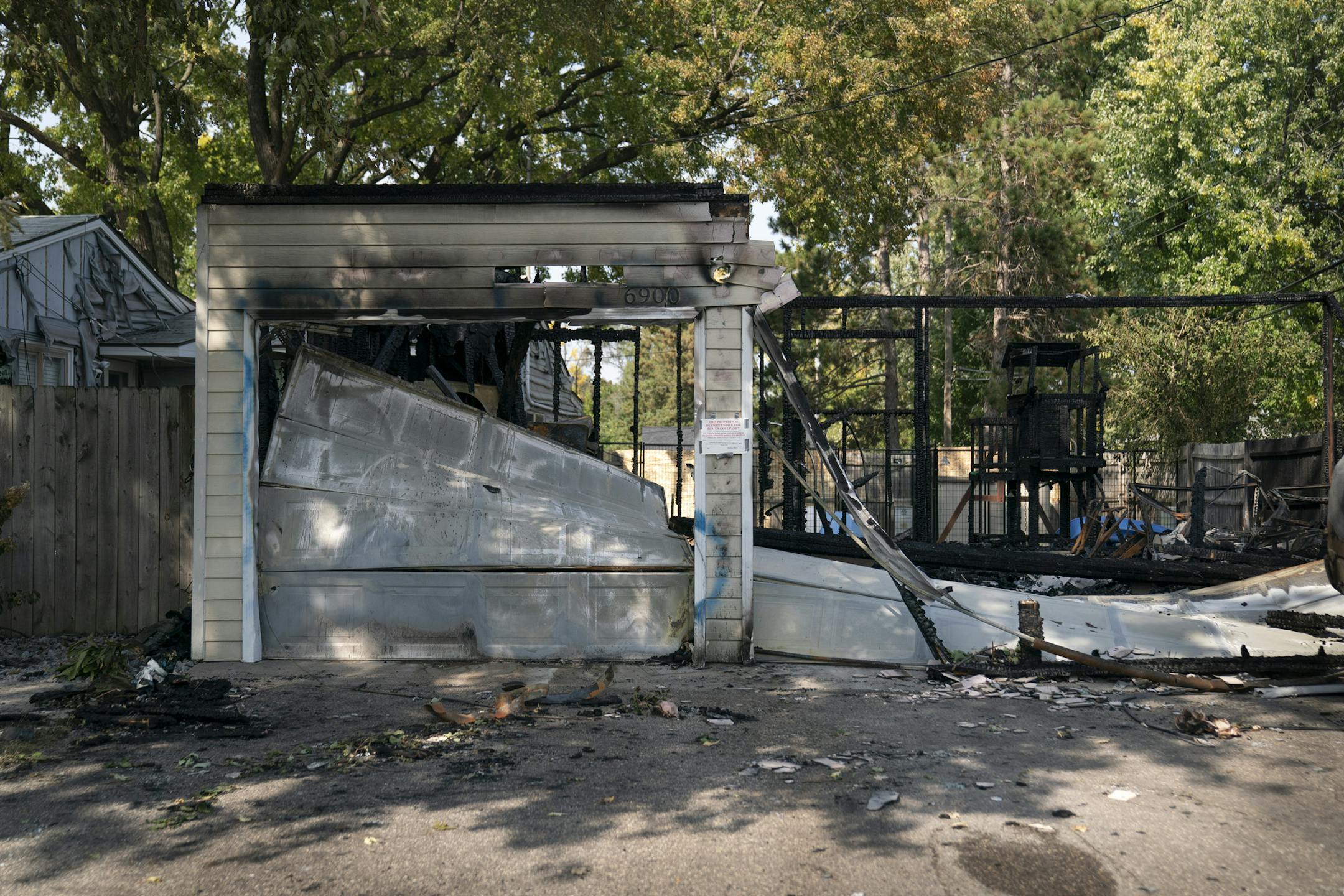 Deana and Dennis Molla's garage and cars were set ablaze in their at home in Brooklyn Center, Minn., on Wednesday, September 23, 2020. The fire has been declared an arson. Dennis' truck had a trump flag in the back that was stolen recently but he had replaced it with a new one before the fire. ] RENEE JONES SCHNEIDER renee.jones@startribune.com