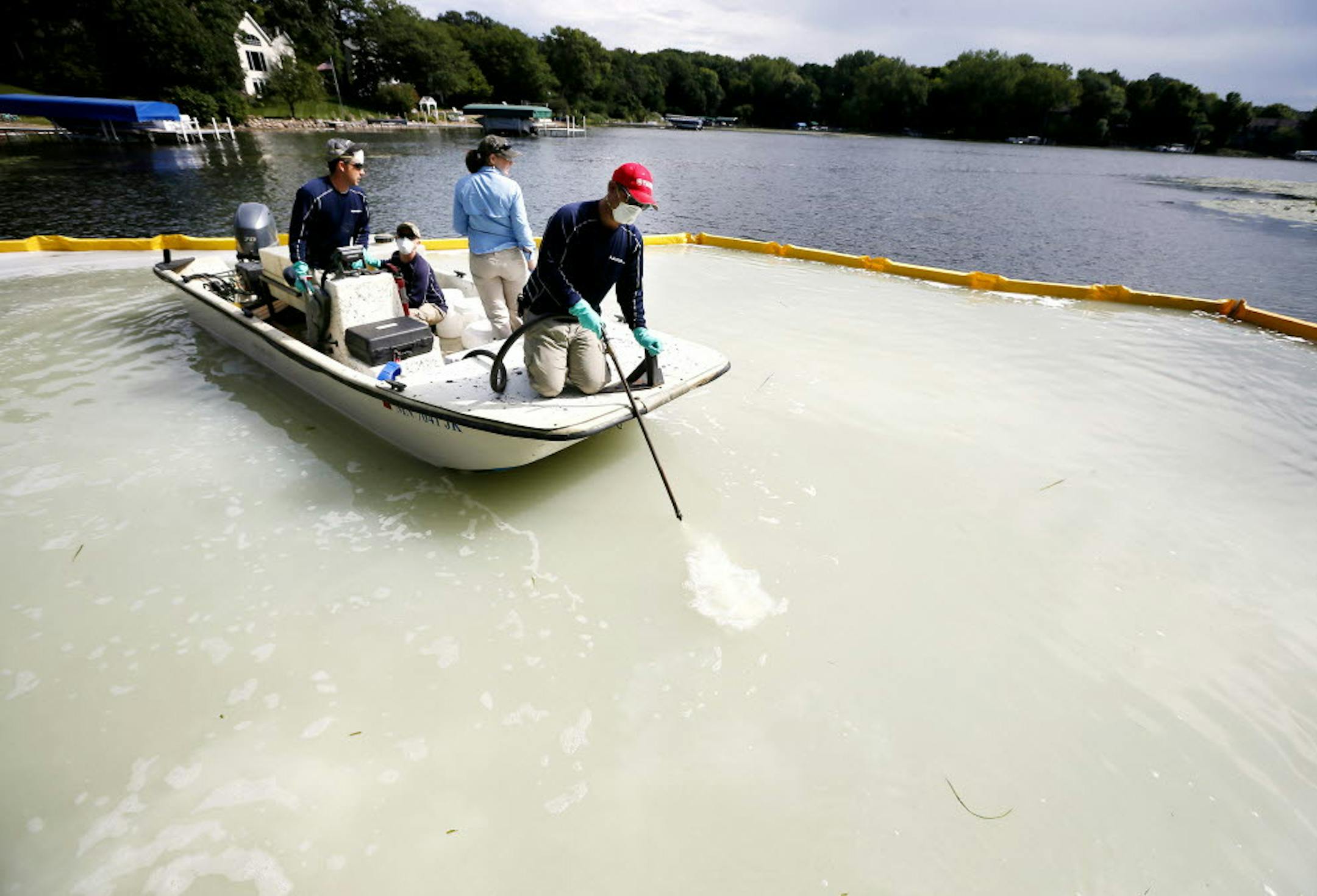 David Hillstrom treated an area on Christmas Lake for zebra mussels Sept. 8, 2014. Federal and state crews tested a product called Zequanox to try an control and infestation of zebra mussels on Christmas Lake. A 50x60 feet section of the lake at the public access was treated.