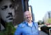 Former actor turned physician Dr. Lee Mark Nelson poses for a photo outside the Guthrie Theater where he once acted and near Mill City Clinic where he