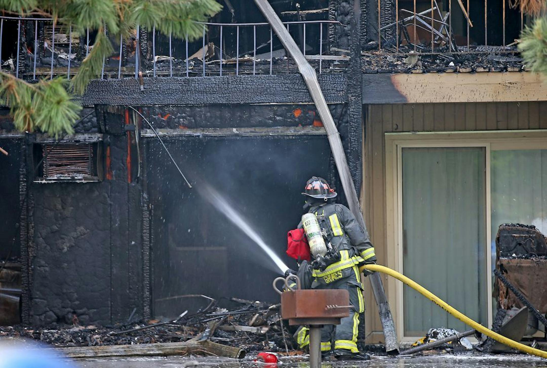 A firefighter on Friday worked the scene of an apartment fire at Beach South Apartments in Robbinsdale.
