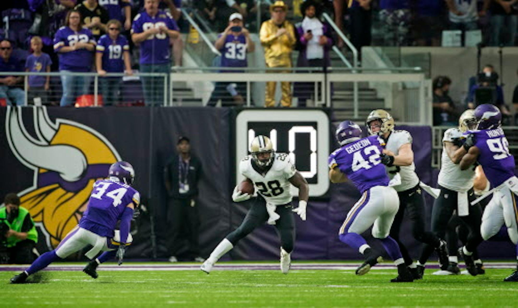 Former Viking superstar Adrian Peterson with his first carry of the game as a New Orleans runningback.  ]  Vikings Home Opener with New Orleans Saints, U.S. Bank Stadium