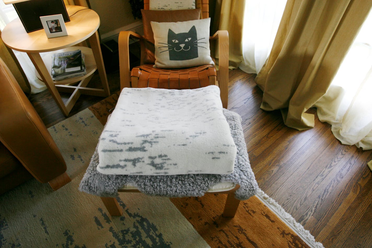 Jacobi's birch-bark blanket (pictured with her birch rug) was featured in the New York Times this year. Her clothing line also includes birch-themed pieces.