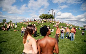 Topless demonstrators meet in Gold Medal Park in Minneapolis in 2015 to show support for gender equity and freedom of expression.