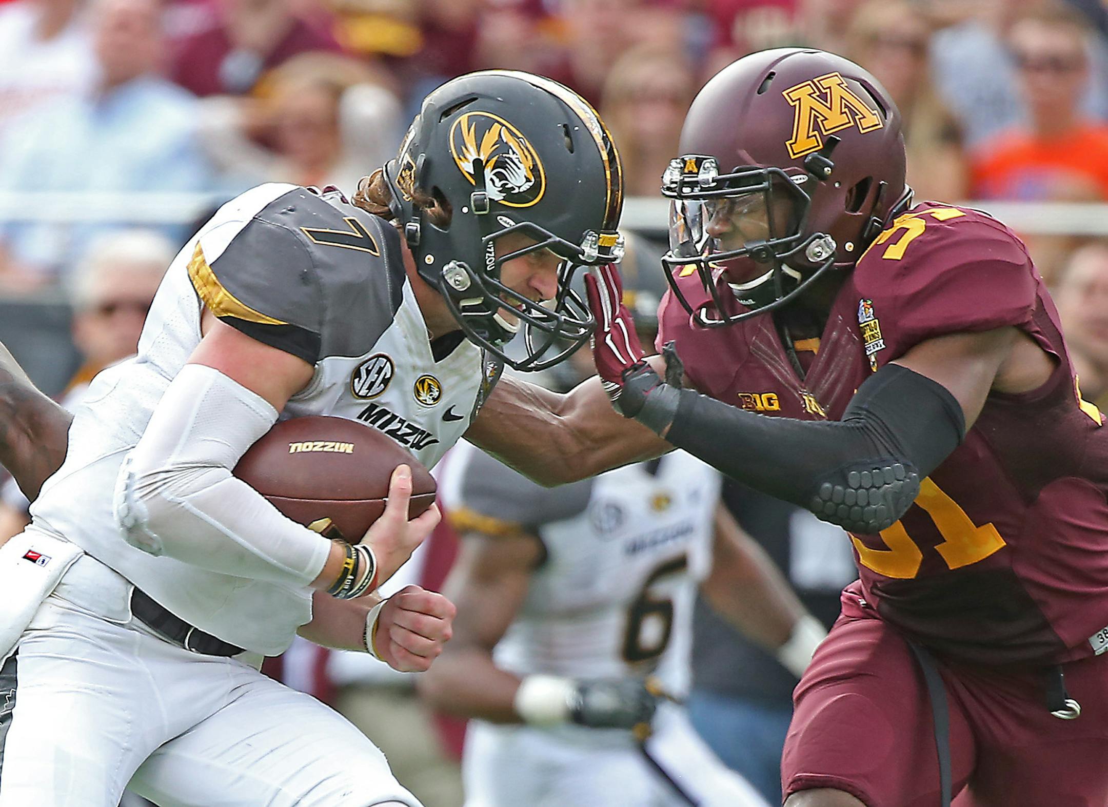 Missouri's quarterback Maty Mauk (7) plowed through Minnesota's defense including defensive back Eric Murray (31) for a touchdown during the third quarter in the Citrus Bowl at Citrus Bowl Stadium, Thursday, January 1, 2015 in Orlando, FL. ] (ELIZABETH FLORES/STAR TRIBUNE) ELIZABETH FLORES &#x2022; eflores@startribune.com