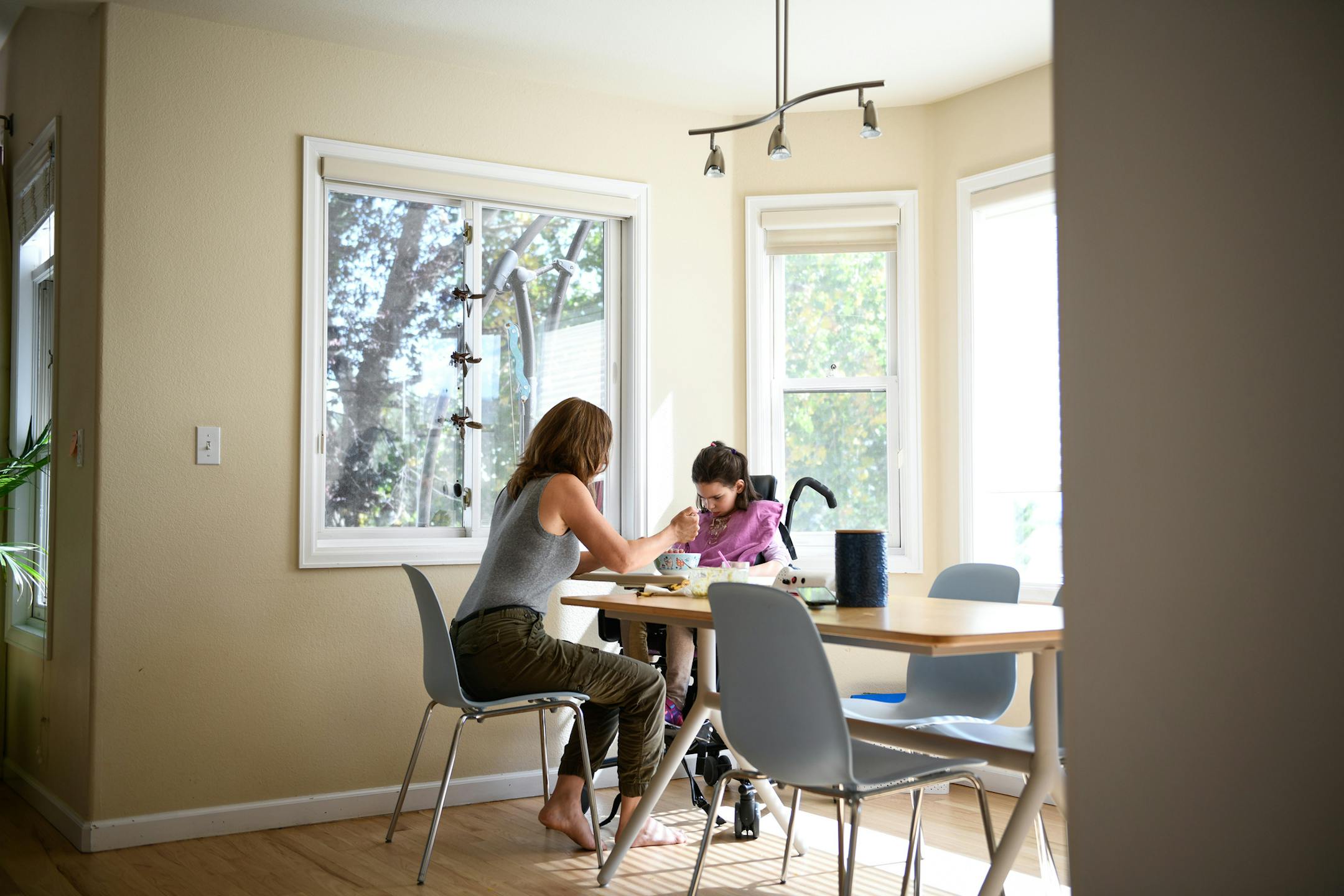 Julia Vitarello with her daughter Mila, 8, who has a rare neurological disorder, at their home in Longmont, Colo., Oct. 9, 2019. Scientists were able to create a drug to treat only the form of the illness she has. (Nick Cote/The New York Times)
