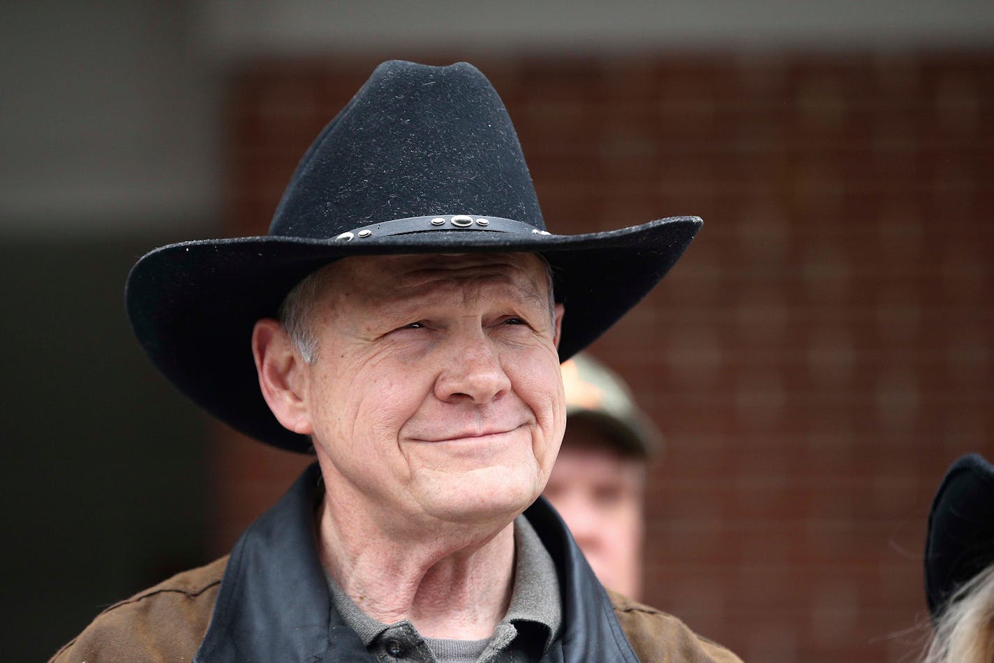 U.S. Senate candidate Roy Moore spoke to the media after he rode in on a horse to vote, Tuesday, Dec. 12, 2017, in Gallant, Ala.