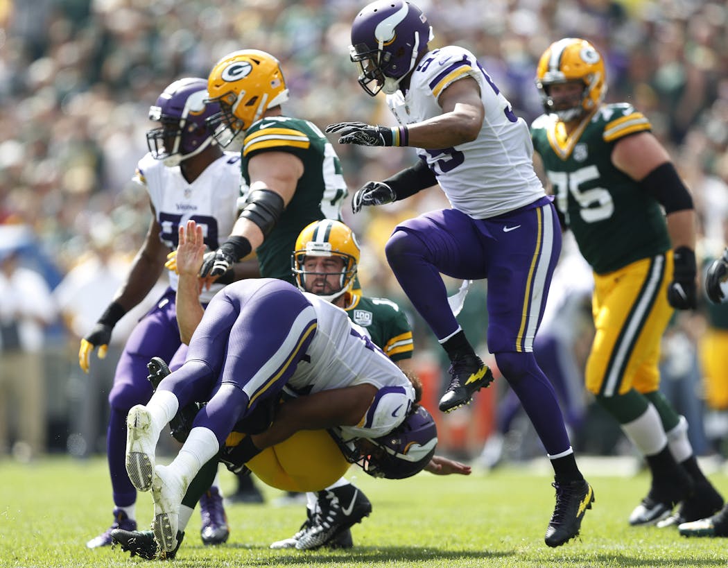Minnesota Vikings linebacker Eric Kendricks was called for roughing as he tackled Green Bay Packers quarterback Aaron Rodgers.