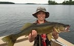 Sam Fulton, 10, of Edina, with a monster walleye he caught on Lake Pokegama.