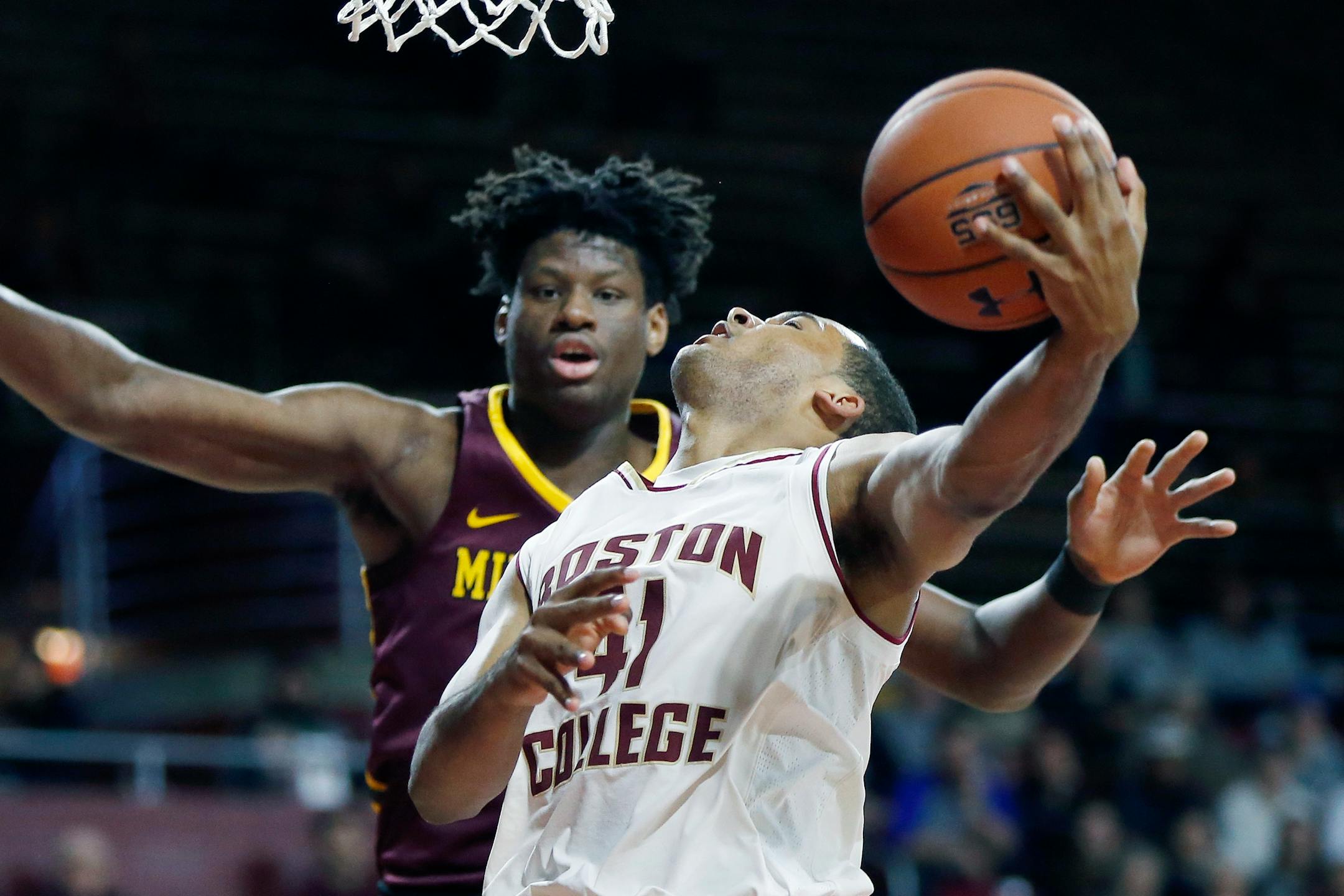 Boston College's Steffon Mitchell (41) shoots against Minnesota's Daniel Oturu during the first half of an NCAA college basketball game in Boston, Monday, Nov. 26, 2018. (AP Photo/Michael Dwyer)