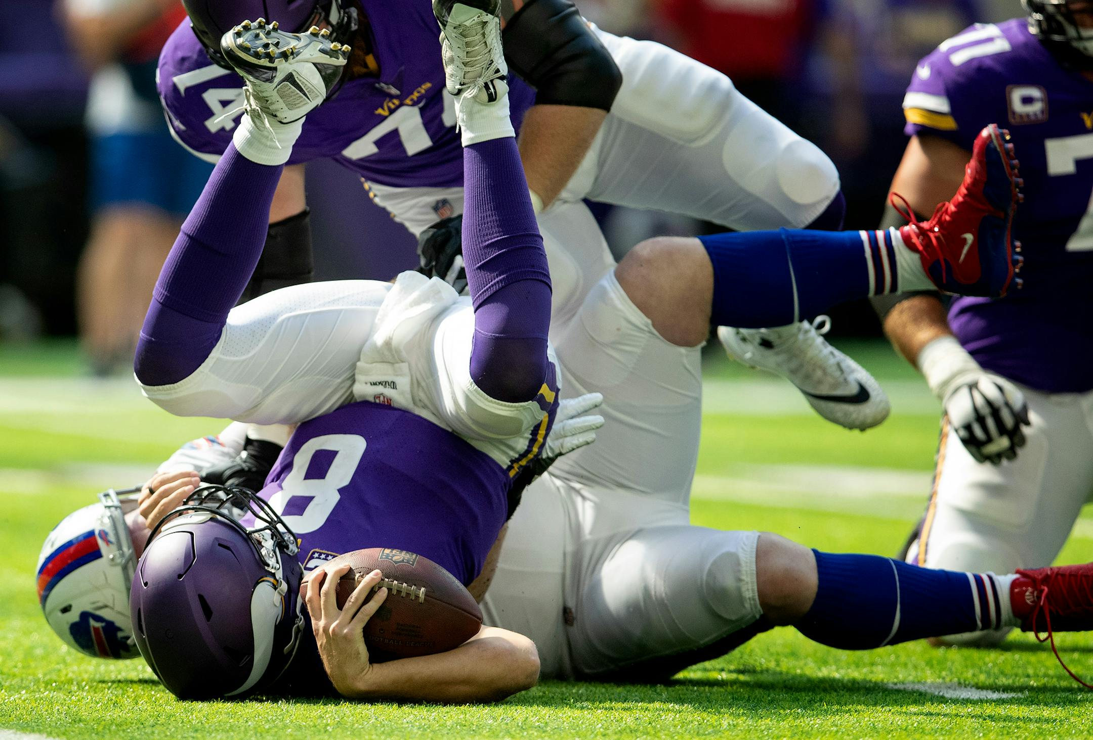 Minnesota Vikings Kirk Cousins (8) was sacked by Kyle Williams (95) in the second quarter. ] CARLOS GONZALEZ ï cgonzalez@startribune.com ñ September 23, 2018, Minneapolis, MN, US Bank Stadium, NFL, Minnesota Vikings vs Buffalo Bills