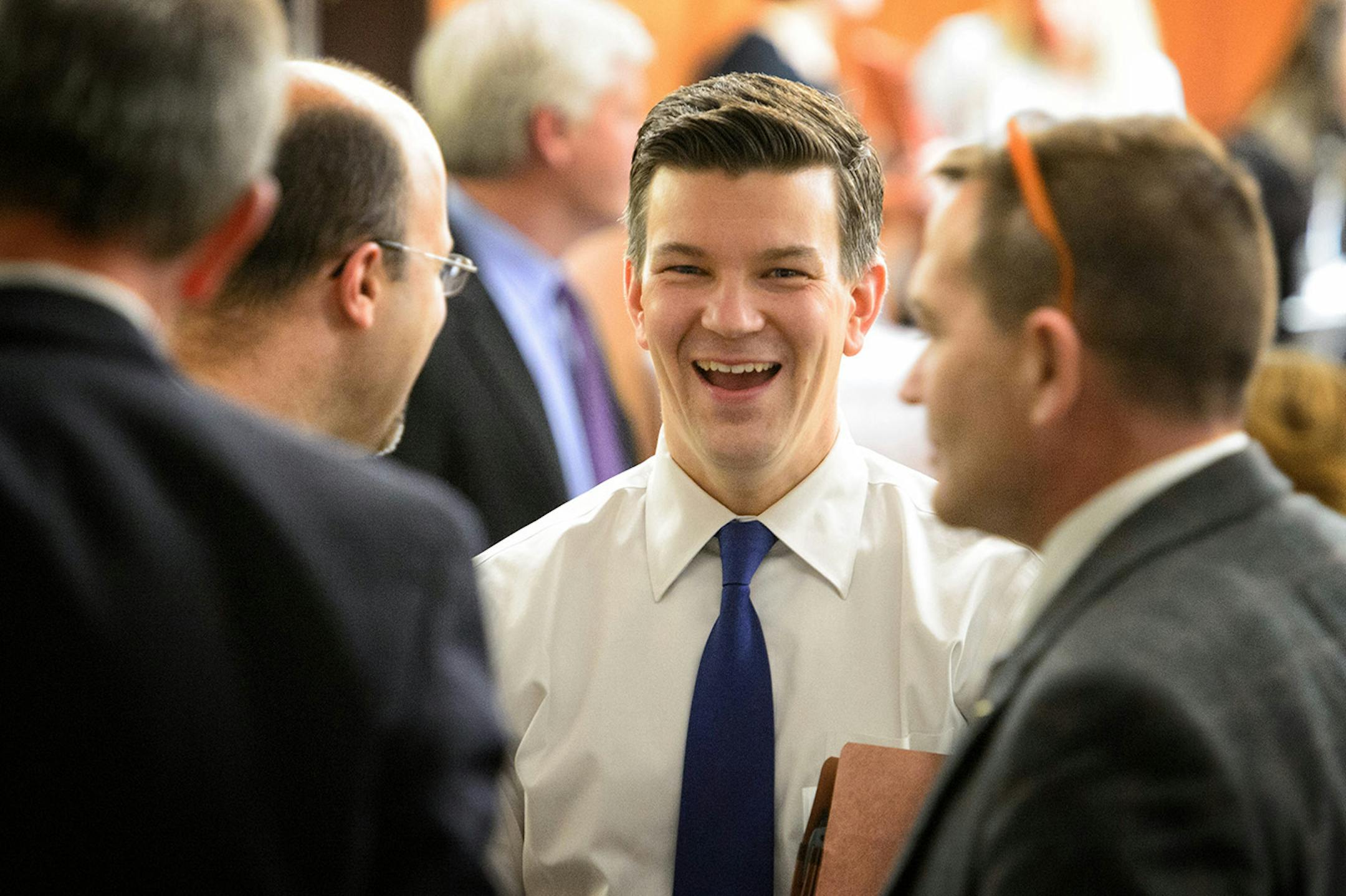 Outgoing Rep. Ryan Winkler laughed with other Reps during a break. At the end of the regular session he announced he was leaving the House.