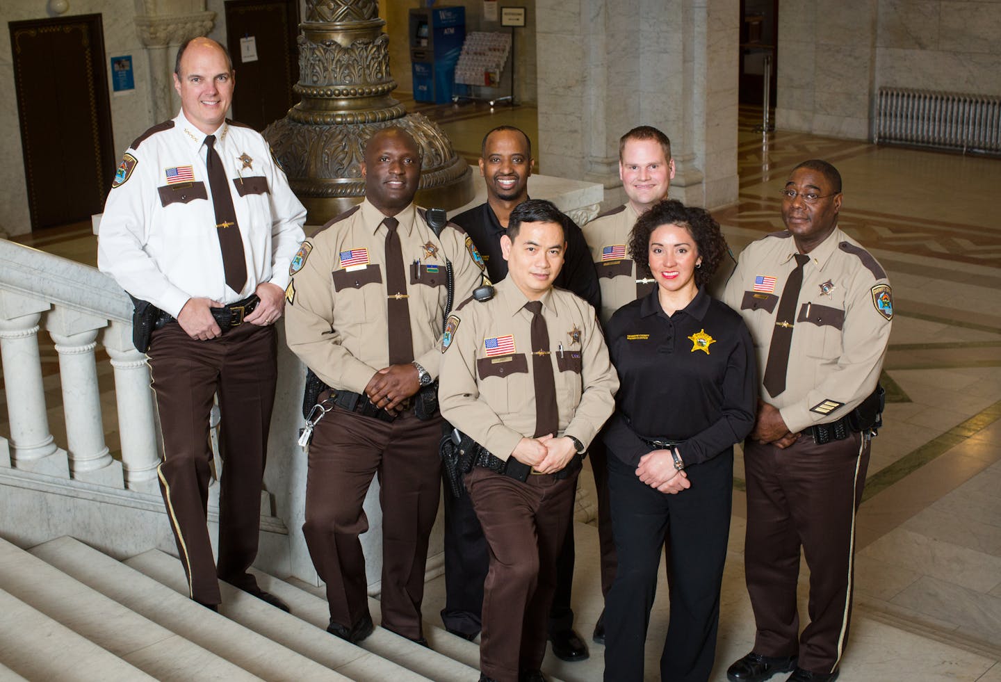 From left to right: back row Sheriff Rich Stanek, Sgt. Kellace McDaniel, Abdi Mohamed, Dep. Adam Hernke, Lt. Dorpha Copeland Fron row: Dep. Thuan Vuong, Carmen Lopez