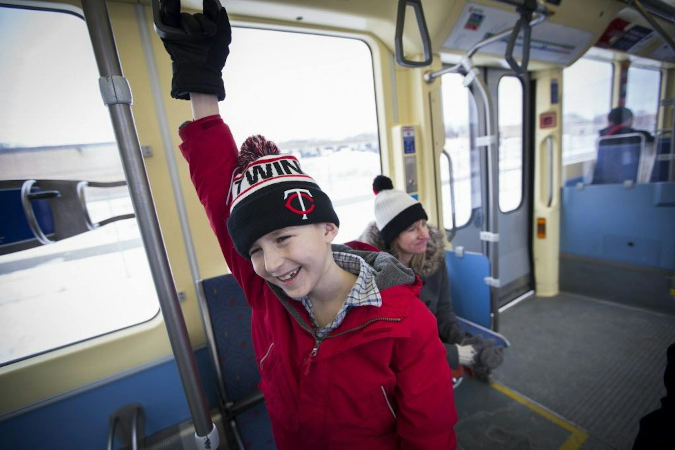 Karlis Barobs is a "trainiac." He rides the train every chance he gets, and is a devoted fan of the Choo Choo Bob train store and TV show. He is pictured while riding the light rail with his mother Jane Meyer on Monday, February 8, 2016 in Minneapolis.