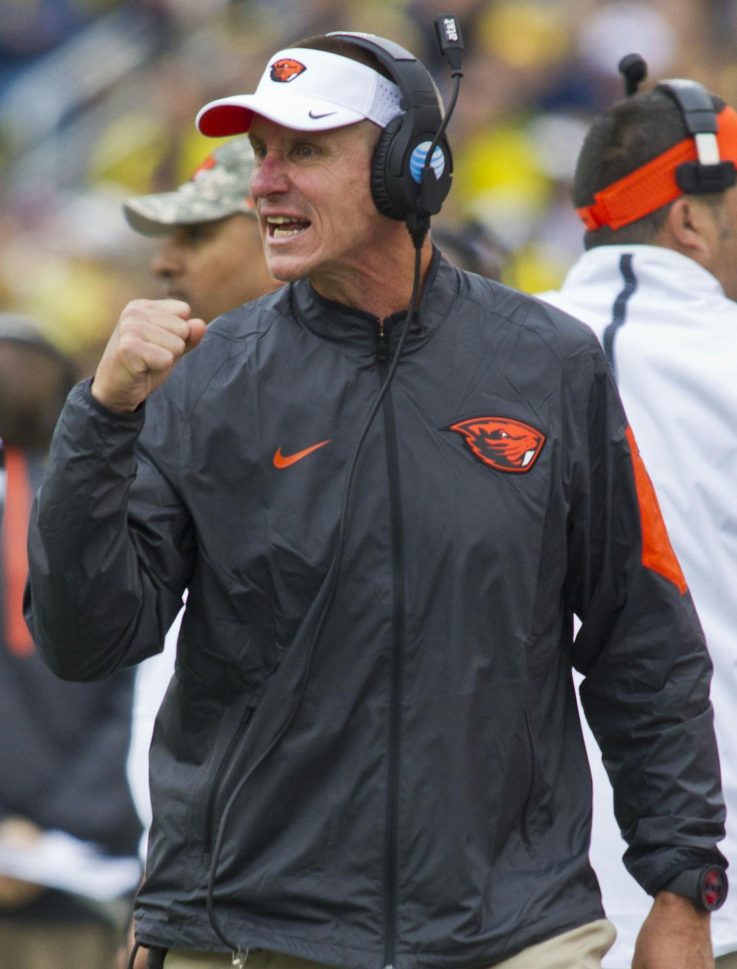 Oregon State head coach Gary Andersen pumps his fist in reaction to a play from the sideline, in the first quarter of an NCAA college football game against Michigan in Ann Arbor, Mich., Saturday, Sept. 12, 2015. (AP Photo/Tony Ding)