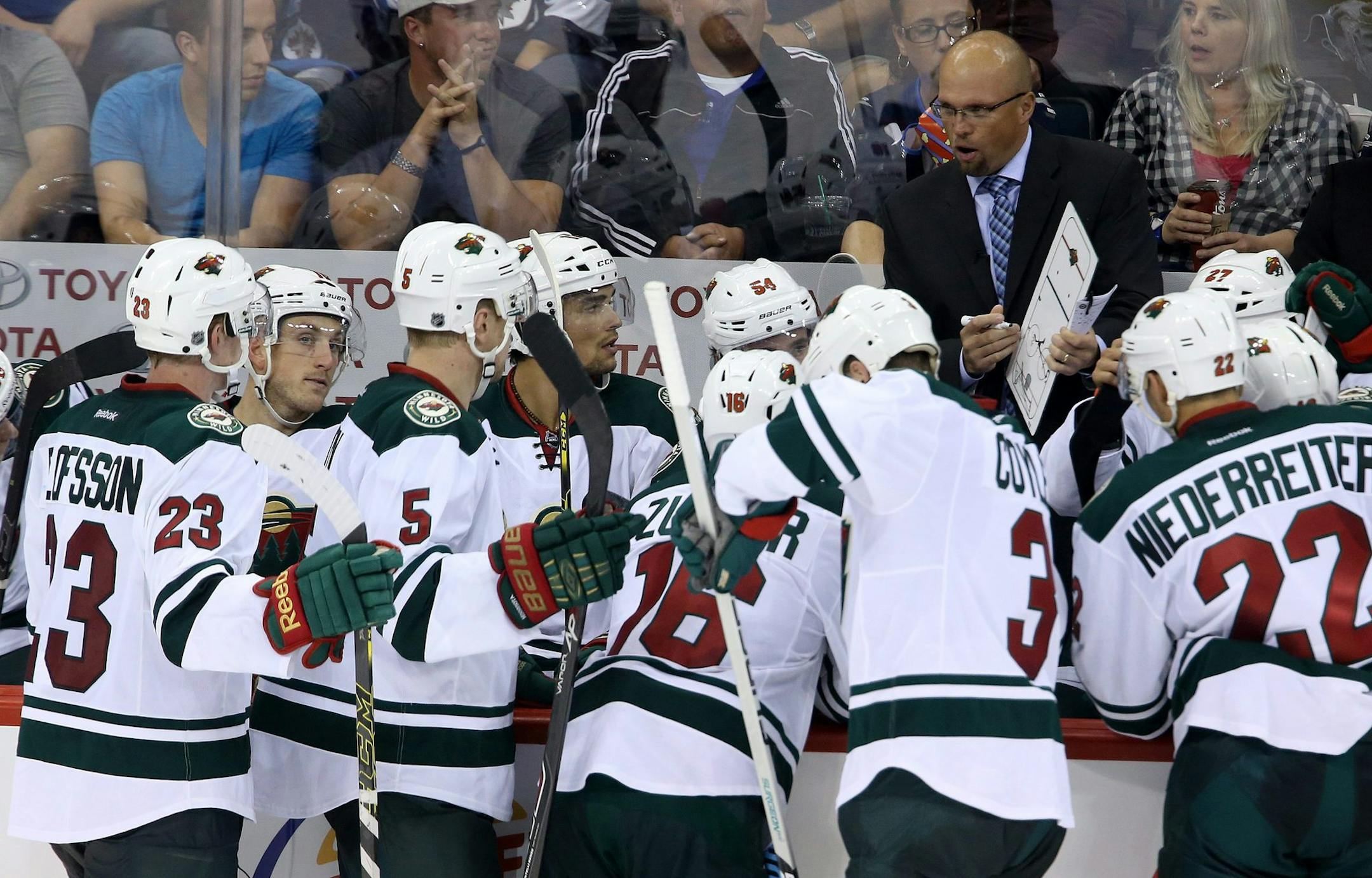 Minnesota Wild head coach Mike Yeo talks to his team earlier this season.