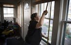 Tasha Julius, production manager for the nonprofit Sustainable Resource Center, measured windows for replacements at the home of Braulia Rendon.