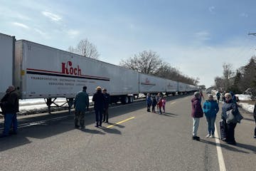 Bryan Lorenzen said he lined up semis outside the plant to help secure it for the president’s visit. Lorenzen works for Koch, which is contracted by