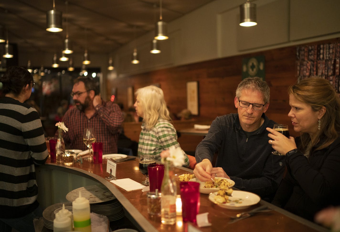 Dave and Lisa Heller ate at the counter at Pizzeria Lola, in line to be the first neighborhood restaurant to get a full liquor license.