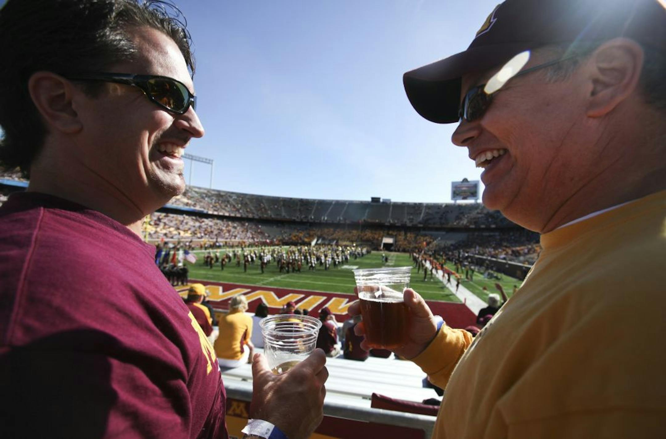 Brothers D.J. Anderson of White Bear Lake, left, and Tom Anderson of Eden Prairie, enjoyed beer near the endzone during the Gophers 44-7 win over New Hampshire Saturday, Sept. 8, 2012, at TCF Bank Stadium in Minneapolis, MN.