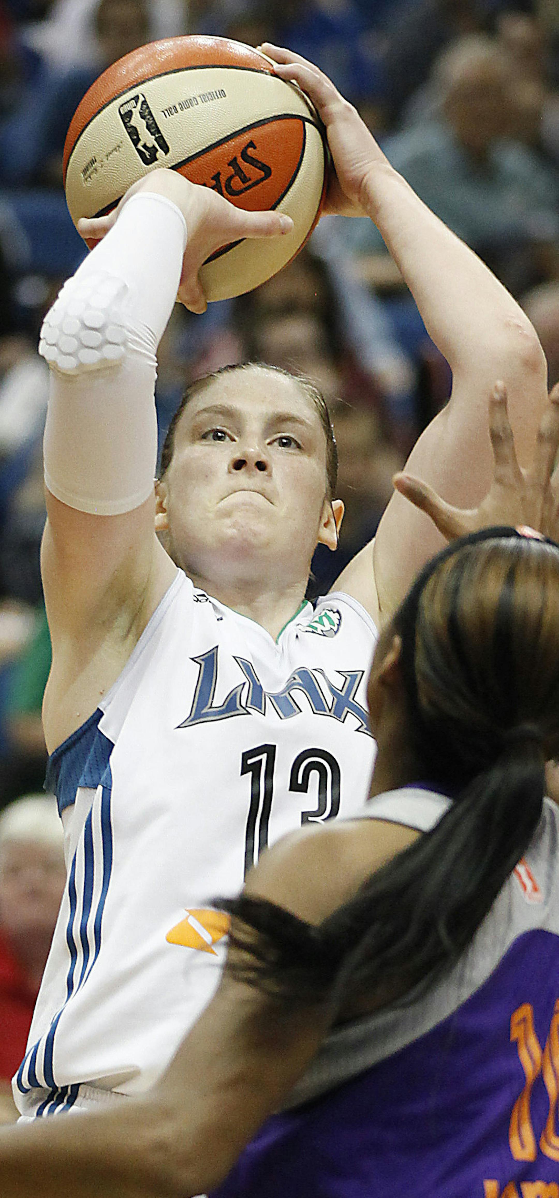 Minnesota Lynx guard Lindsay Whalen shoots against Phoenix Mercury guard Jasmine James (10) during Game 1 of the WNBA basketball playoffs Western Conference finals on Thursday, Sept. 26, 2013, in Minneapolis. (AP Photo/Stacy Bengs) ORG XMIT: MNSB110
