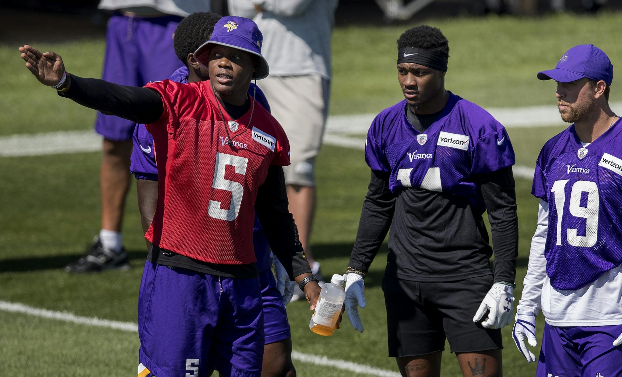 Minnesota Vikings quarterback Teddy Bridgewater spoke to receivers Stefon Diggs and Adam Thielen during morning practice Thursday.