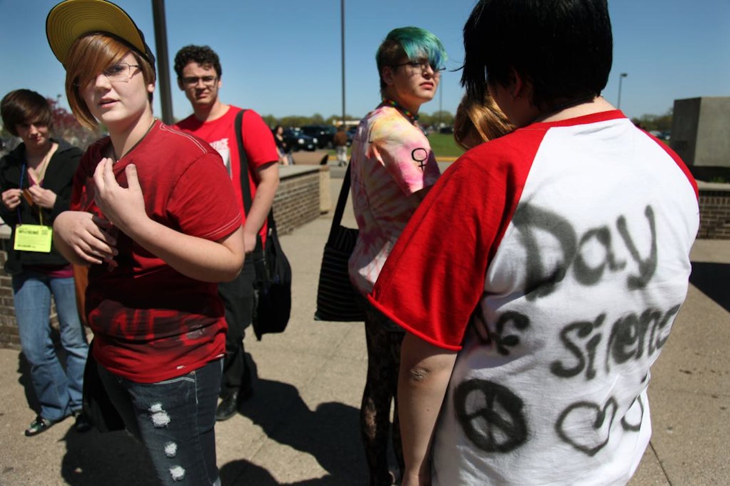 Kira Martin, 17, stood in silence with other studets for the Day of Silence at Anoka High School, Friday, April 20, 2012. GLBT students and their allies kept their quiet to protest the silencing effect of anti-LGBT bullying and harassment in schools. After last month's landmark legal settlement in Anoka Hennepin, teachers were wearing T-shirts in solidarity with participating students. The policy that was reversed before the settlement would have prohibited them from doing so.(ELIZABETH FLORES/S