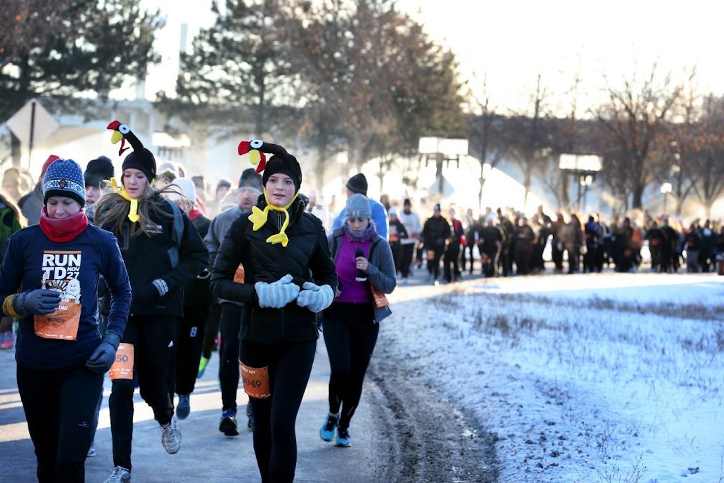 Runners race on W. River Parkway along the Mississippi during the LifeTime Turkey Day 5K in downtown Minneapolis on Thursday, November 27, 2014.