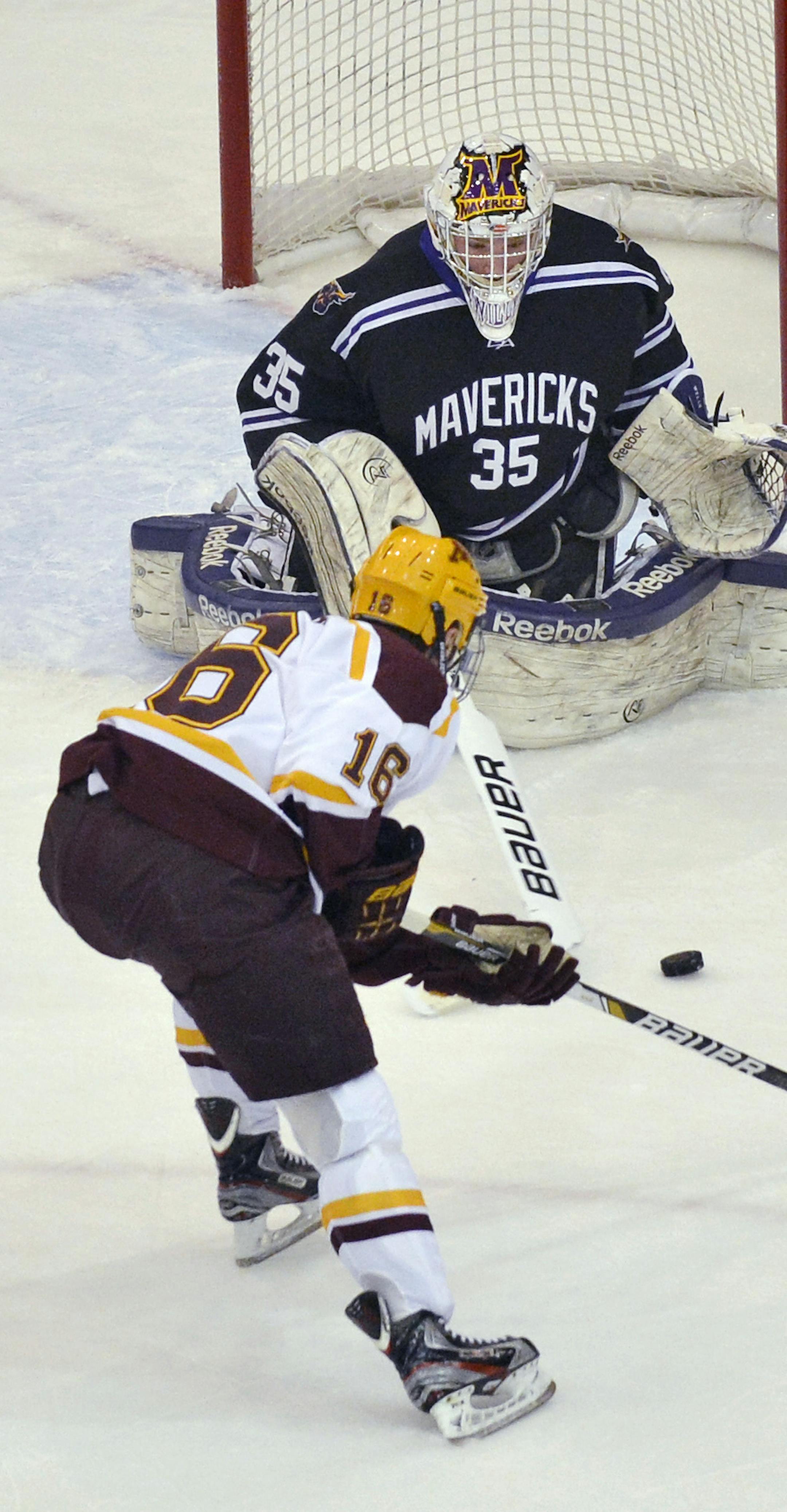 Minnesota State, Mankato goaltender Stephon Williams prepares to stop a shot by Minnesota's Nate Condon during the first period of a college hockey game Friday, Jan. 25, 2013, in Minneapolis. (AP Photo/Bre McGee) ORG XMIT: MNBM102