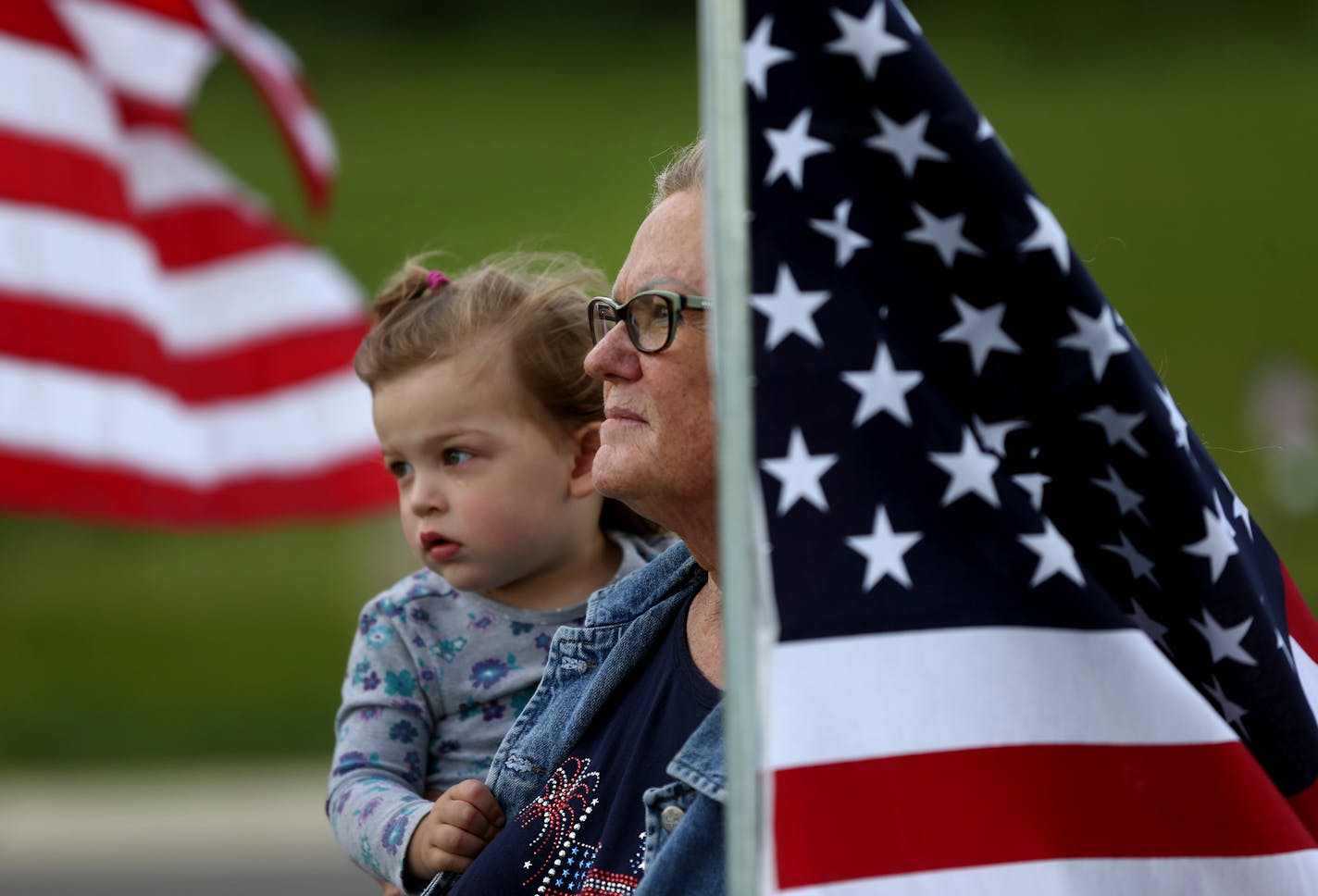 Dori Greene of Dodge Center held her 1-year-old granddaughter Amelia Wittmeier during the dedication of the Minnesota State Veterans Cemetery in Preston on Sunday, May 29.