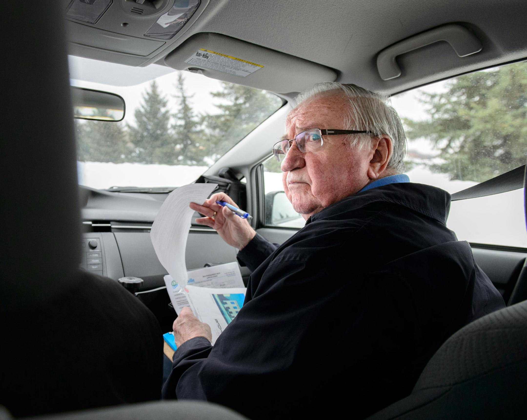 Burnsville volunteer Bill Johnson kept an eye out for illegal roadside signs as he drove around Burnsville with code inspector Ron Anderson. He has been a volunteer for around 10 years,. ] GLEN STUBBE * gstubbe@startribune.com Friday March 7, 2014