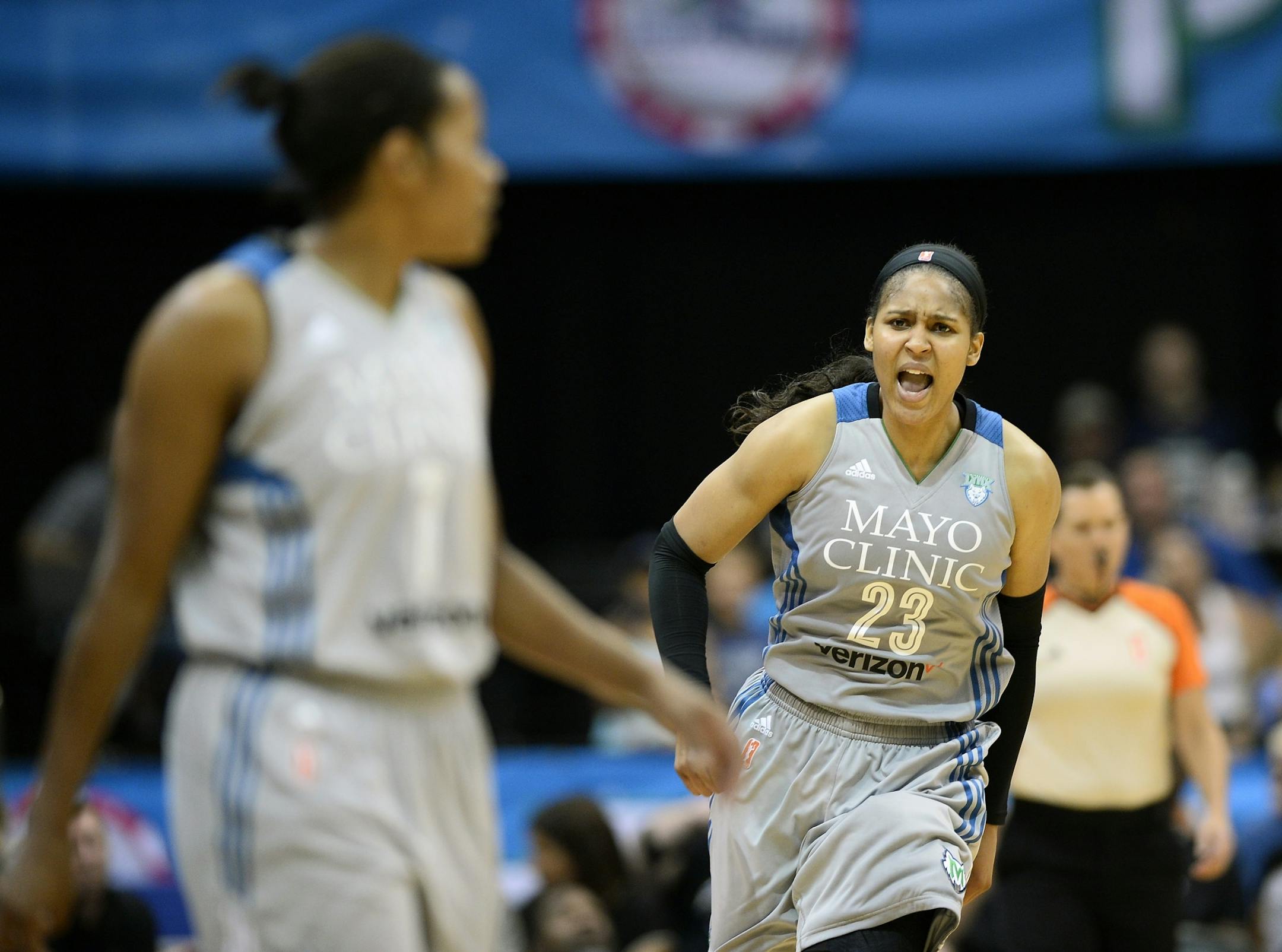 Minnesota Lynx forward Maya Moore (23) celebrated a blocked shot, leading to a shot clock violation, by guard Jia Perkins (7) in the third quarter Friday night.