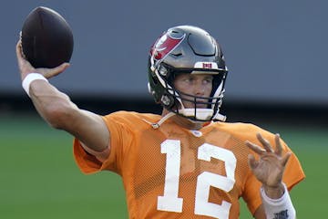 Tampa Bay Buccaneers quarterback Tom Brady (12) throws a pass during an NFL football training camp practice Friday, Aug. 28, 2020, in Tampa, Fla. (AP 