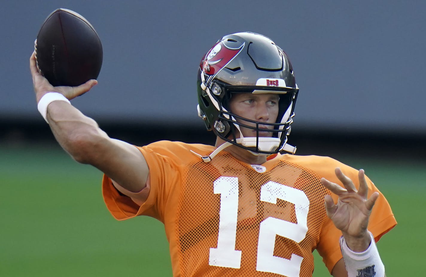 Tampa Bay Buccaneers quarterback Tom Brady (12) throws a pass during an NFL football training camp practice Friday, Aug. 28, 2020, in Tampa, Fla. (AP Photo/Chris O'Meara)