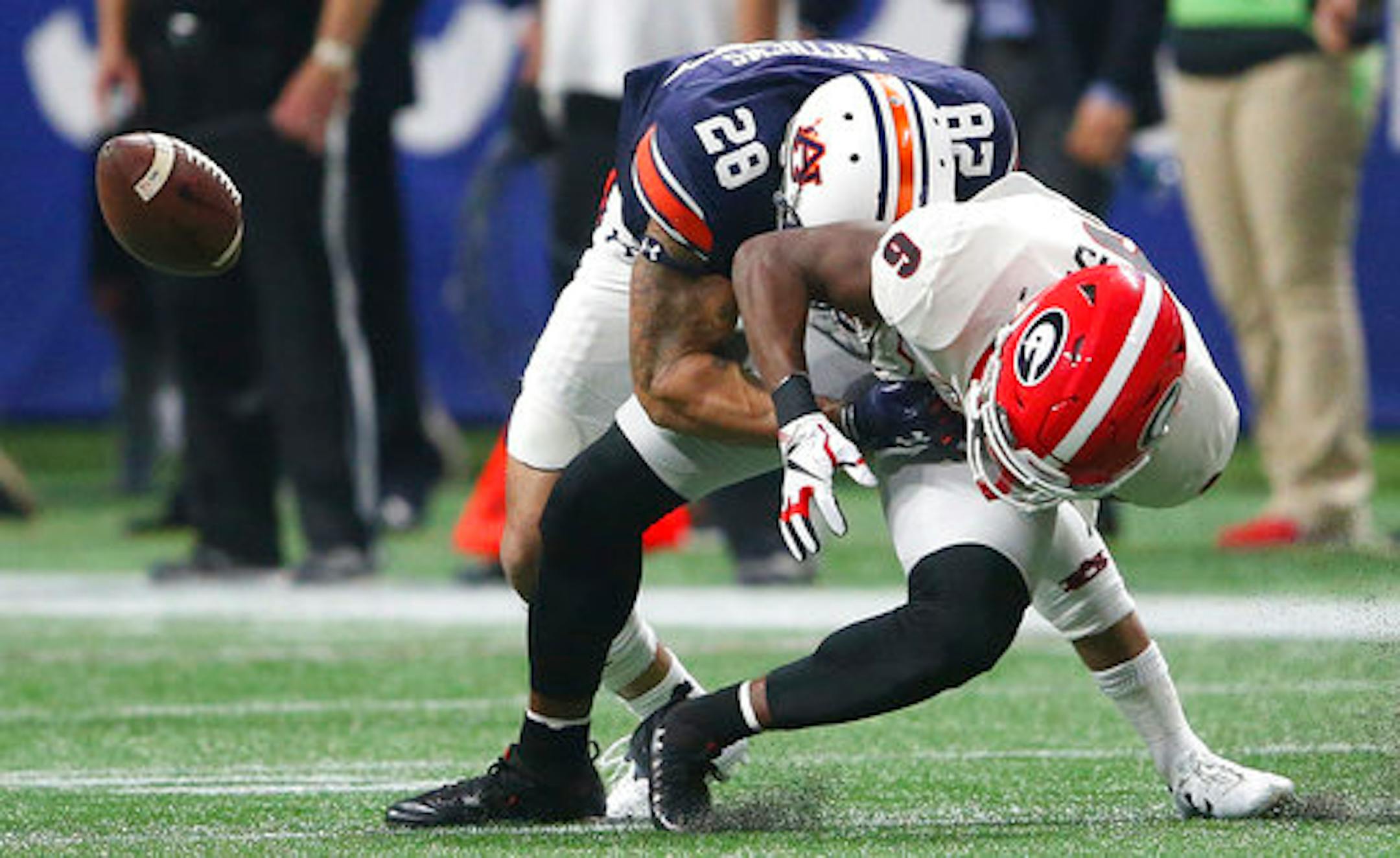 Georgia wide receiver Javon Wims (6) misses the catch against Auburn defensive back Tray Matthews (28) during the second half of the Southeastern Conference championship NCAA college football game, Saturday, Dec. 2, 2017, in Atlanta. (AP Photo/John Bazemore)