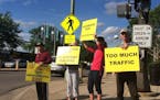 About a dozen St. Louis Park residents protested plans this week for the Bridgewater, a proposed apartment and retail complex at the corner of Excelsi