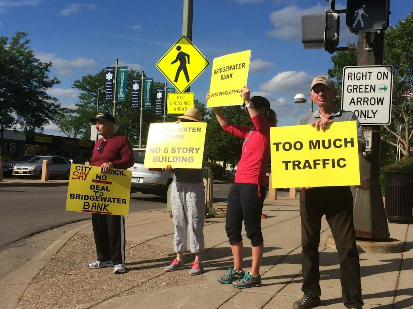 About a dozen St. Louis Park residents protested plans this week for the Bridgewater, a proposed apartment and retail complex at the corner of Excelsior Boulevard and Monterey Drive. The City Council is considering whether to grant approval to the project.