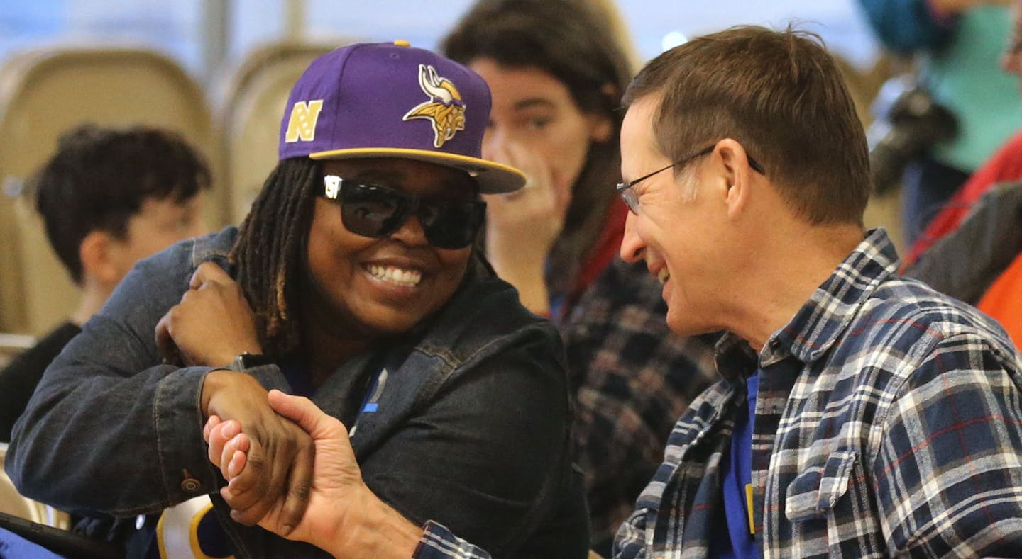 Members of Education Minnesota, the state teachers' union, rallied at the Minneapolis Labor Union office before marching downtown for early voting Friday, Oct. 19, 2018, in Minneapolis, MN. Here, Edina Brown, left, a construction laborer for Mortenson Construction, left, and David Bipes, a retired computer tech for Minneapolis Public Schools, shook hands while meeting before the start of the rally.] DAVID JOLES &#xef; david.joles@startribune.com The November election is a particularly high-stake