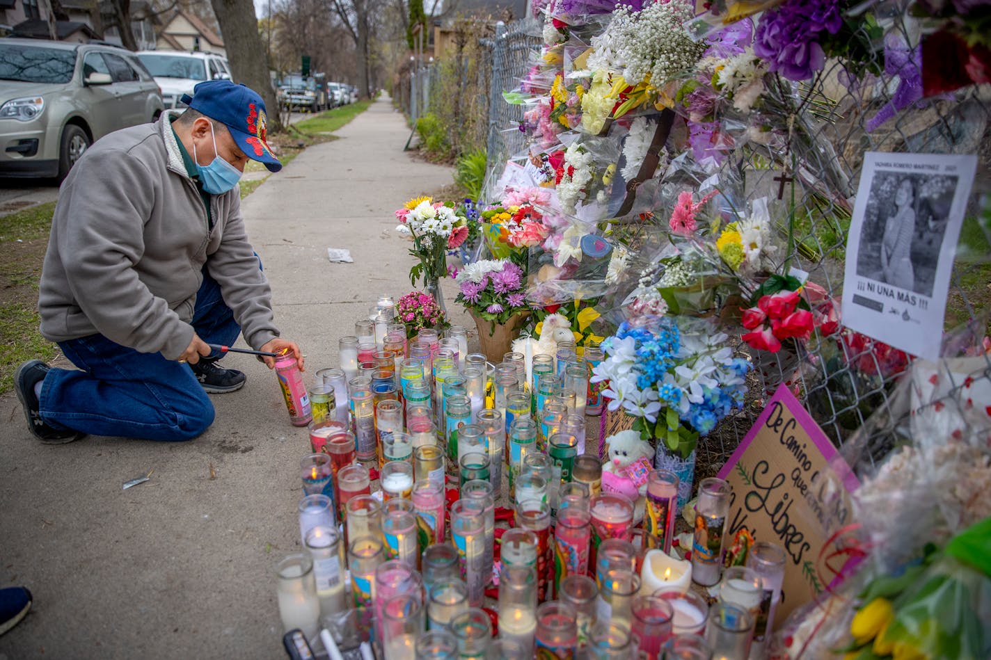 "Ni me lo puedo imaginar lo que están pasando los padres de la joven desde Mexico y tan lejos," ("I can't even imagine what the parents are going through from Mexico and being so far away,") said Erasto Garcia as he lit a candle for homicide victim Yadira Romero Martinez at the site where her body was found, Sunday, April 25, 2021 in Minneapolis, MN. ] ELIZABETH FLORES • liz.flores@startribune.com