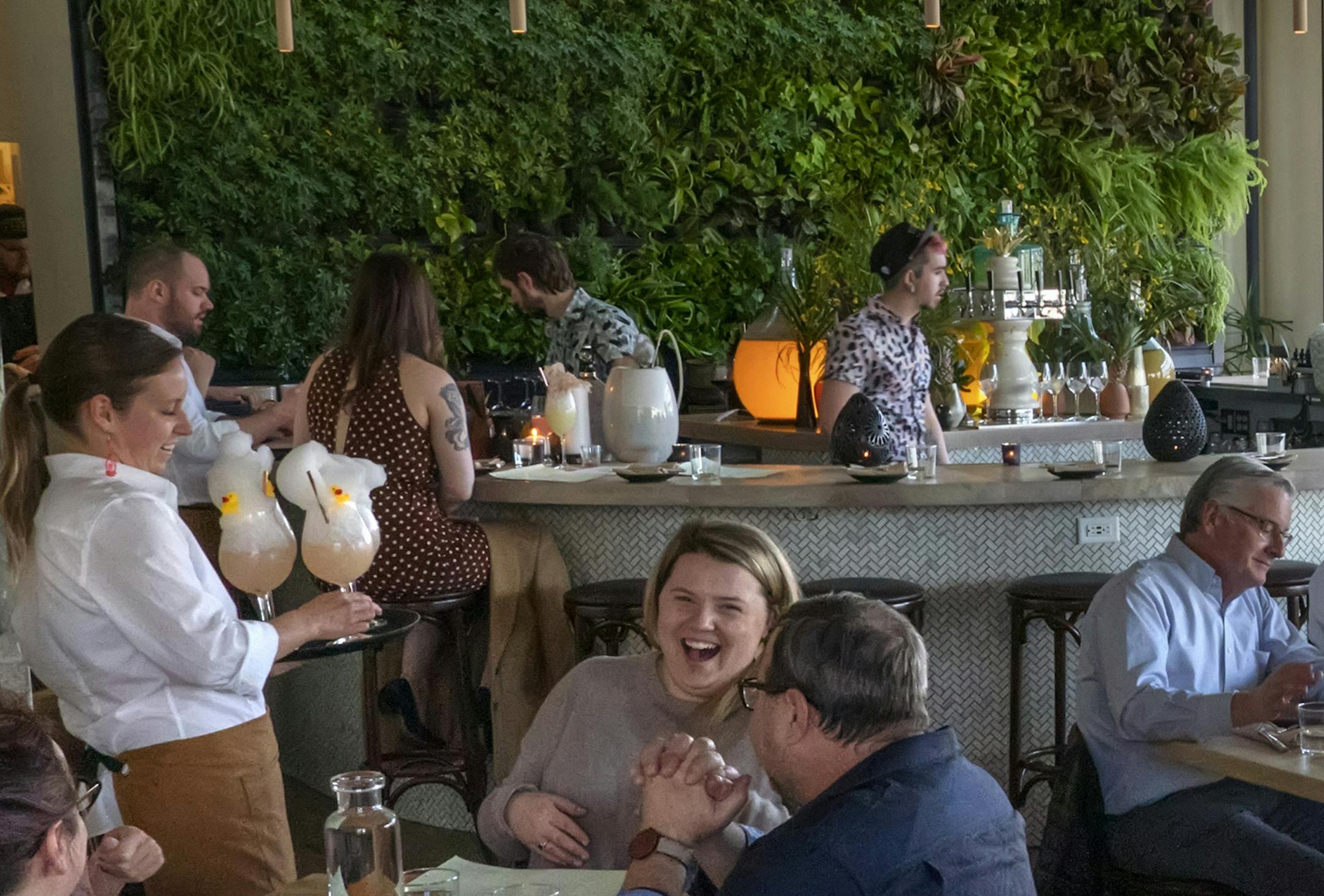 The lush living wall behind the bar at Colita in Minneapolis is popular with customers, especially during the colder months.